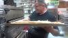 Frank Giaquinto Slides A Pizza Into The Oven Off The Handle On A Wooden Pizza Peel